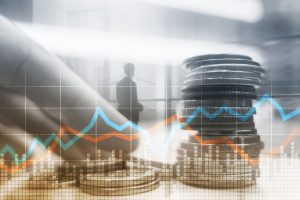 Double exposure of city and rows of coins with stock and financial graph on virtual screen. Business Investment concept